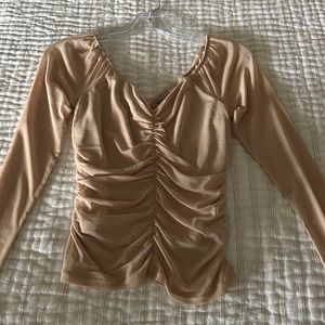 Tan long sleeve top, ruched in the middle on the front and back!